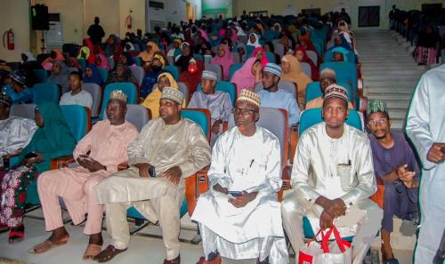 A cross section of participants listening to the governor's speech