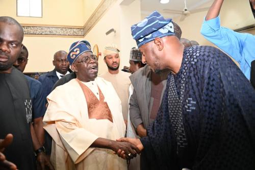 Governor Dikko Radda of Katsina state in a warm handshake with President Bola Ahmed Tinubu after the jummat prayers at the Dolphin Community Mosque in Ikoyi Lagos shortly after he joined his colleague Governors to pay Sallah homage to the President on Friday... Photo. Government House Katsina